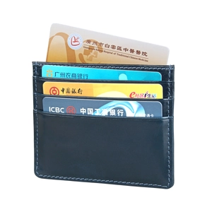 Close-up of black leather RFID card holder featuring multiple slots and blue contrast stitching