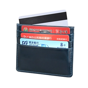 Detail view of the sleek leather card holder showing three card slots and stitching