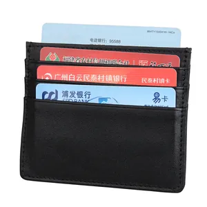 Detail view of black leather RFID card holder featuring 4 slots and reinforced stitching