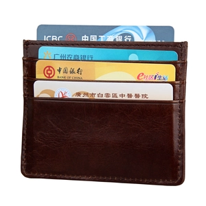 Detail view of stitching and card slots on dark brown slim leather RFID wallet