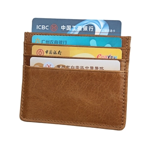 Detail of brown litchi pattern leather RFID card holder with four precision-stitched slots
