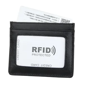 Detailed macro view of black genuine leather RFID card holder with clear ID window