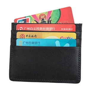 Detail of black leather RFID card holder showing three slim slots with fine stitching