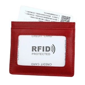 Detail view of red lychee grain leather RFID card holder with transparent ID window