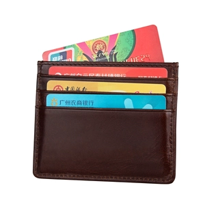 Detail of dark brown leather card holder featuring RFID protection and multi-slot design