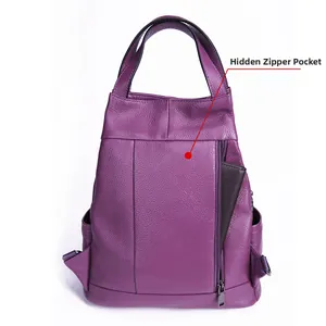Detail view of purple leather backpack featuring pebble grain texture and hidden vertical zipper