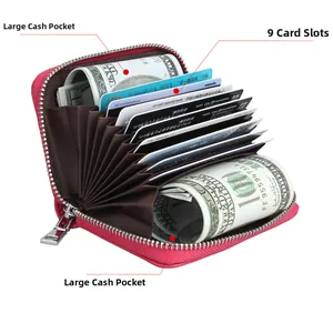 Detail view of pink leather accordion wallet with 9 card slots and 2 large cash pockets