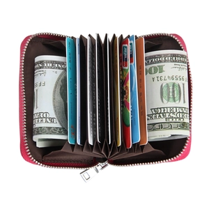 Macro view of rose red leather accordion card holder showing internal slots and RFID protection