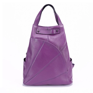 Detail of purple lychee grain leather backpack with asymmetrical stitching and metal buckles