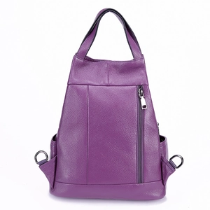 Detail view of purple lychee grain leather backpack with vertical zipper and trapezoid shape