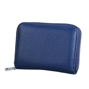 Close-up of royal blue leather card holder showing lychee grain texture and metal zipper