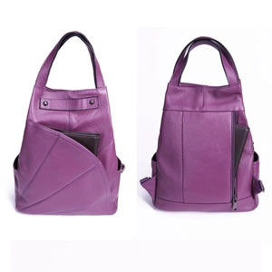 Front and back view of purple pebbled leather backpack with functional zipper pockets