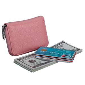 Pink lychee grain leather card holder with cash and credit cards showing storage capacity