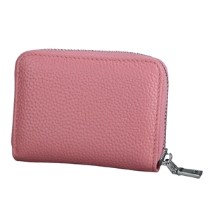 Detailed macro view of pink lychee grain leather wallet with a secure metal zipper
