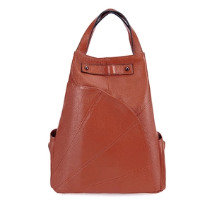 Close-up of brown pebbled leather backpack with radial stitching and sturdy top handle