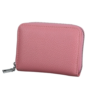 Detail of pink lychee leather card holder featuring a smooth silver metal zipper