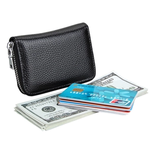 Close-up of black lychee grain leather RFID card holder with multiple cards and bills