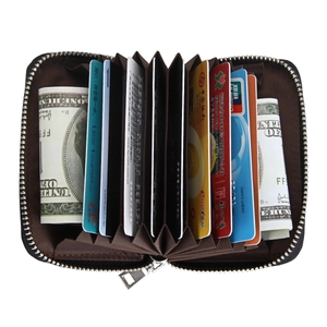 Detail showing the accordion interior of a dark brown leather card holder with RFID slots