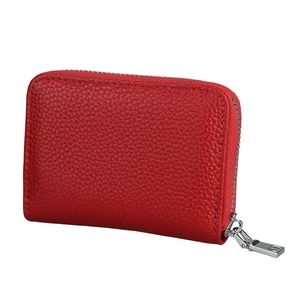 Detail of red pebbled leather card holder with secure silver zipper and fine stitching
