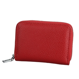 Macro detail of red litchi grain leather wallet with silver U-shaped zipper and metal slider