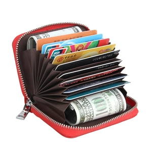 Open view of red RFID leather accordion card holder with multiple slots and zipper closure