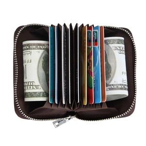Macro view of leather accordion card holder showing RFID card slots and cash storage