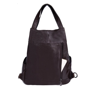 Close-up of leather backpack with vertical anti-theft zipper pocket and phone storage
