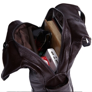 Detail of dark brown pebble grain leather bag showing large storage capacity and interior