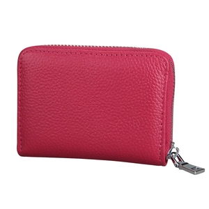 Detailed view of rose pink pebble leather card holder with secure metal zipper closure