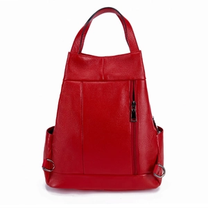 Macro detail of red litchi texture leather backpack with vertical zipper pocket