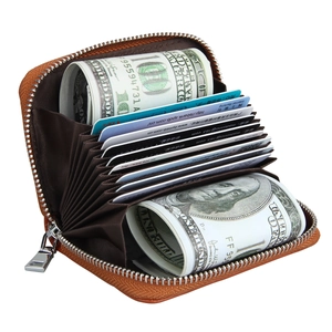 Detail view of brown leather RFID card holder with 11 accordion slots and compartments