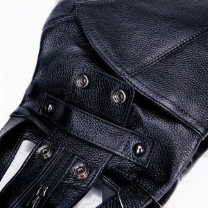 Detailed close-up of premium black lychee grain leather and secure metal snap buttons