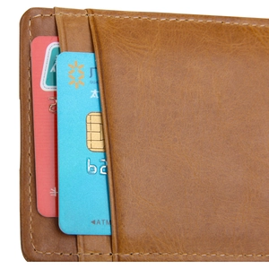 Detail of vintage brown leather card holder with multi-layer slots and stitching