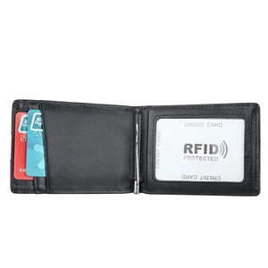 Macro detail of black leather wallet interior with RFID protection card and metal money clip