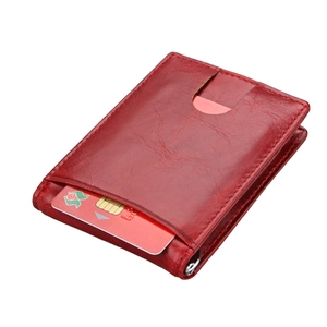 Close-up of slim red pebble leather RFID wallet with card slot and silver metal ring