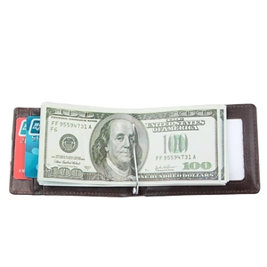 Detail of brown leather RFID wallet featuring a metal money clip and card slots