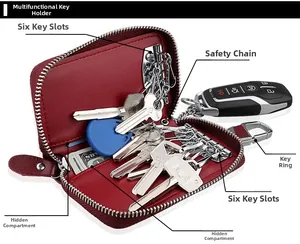 Detail of red leather car key case with 6 slots, zipper closure and banknote pocket