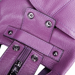 Close-up of purple litchi grain leather backpack with high-quality metal zipper details