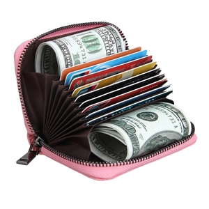 Pink leather RFID card holder with accordion slots and durable metal zipper closure