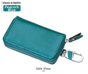 Peacock blue leather car key case with metal hook and zipper closure side view