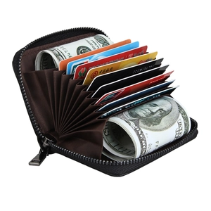 Detailed view of leather RFID card holder with accordion slots and cash storage