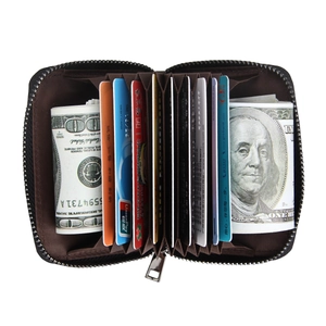 Detail view of leather accordion card holder showing internal slots and RFID storage capacity