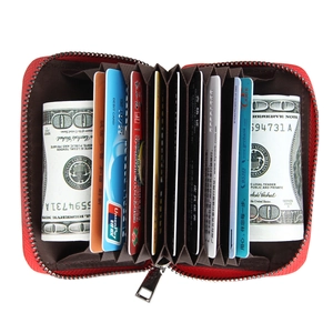 Detail view of red leather accordion card holder with multi-slot RFID blocking design