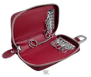 Detail view of red leather car key case interior with six metal hooks and ring