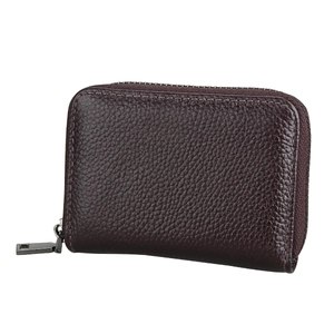 Close-up of litchi grain leather card holder with secure metal zipper and stitching