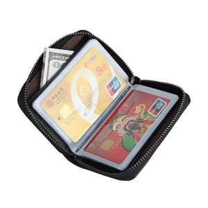Close-up of black leather RFID card holder with multiple PVC slots and a metal zipper