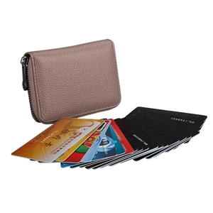 Detail of genuine leather RFID card holder with accordion slots and pink litchi texture