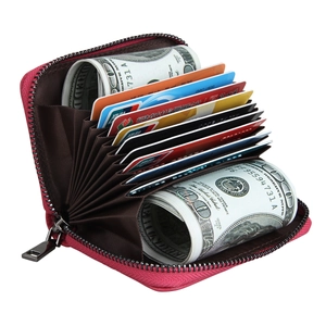 Interior detail of a rose leather RFID card holder with 11 accordion slots and metal zipper