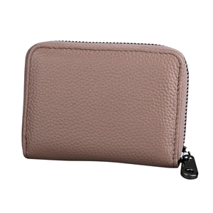 Macro shot of litchi grain leather card holder with secure U-shaped zipper detail