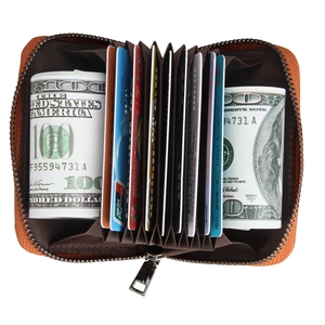 Detail view of the orange leather card holder featuring RFID blocking accordion slots